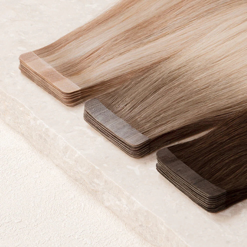 Set of hair extensions on a textured beige background