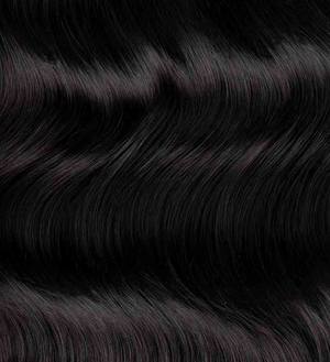 Close-up of Natural Black hair extensions with a focus on texture and color.